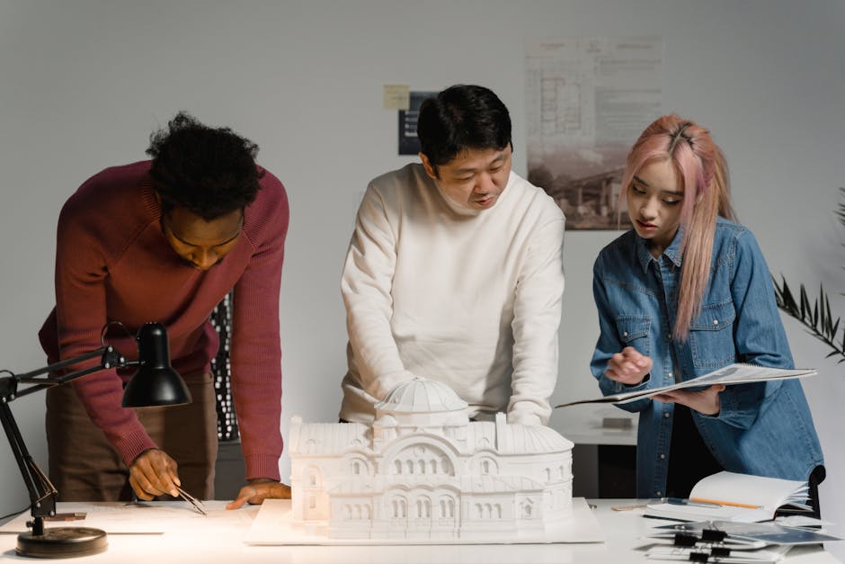 Architect working on municipal approval drawings with technical specifications for Nashik building project